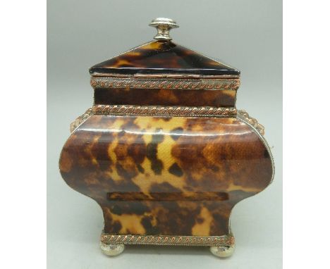 A faux tortoiseshell tea caddy