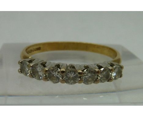 An 18ct gold, seven stone diamond ring, weight 2.3g, size M