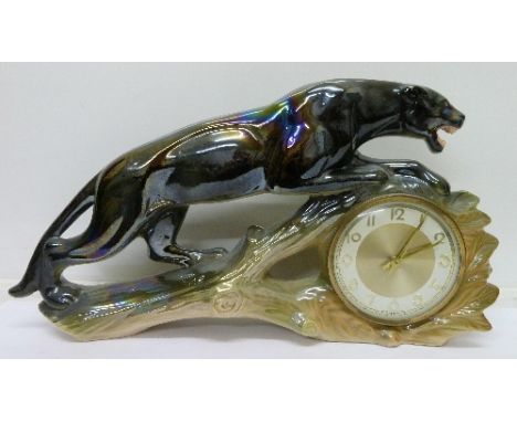 An Art Deco stylised Jaguar mantel clock by Jema of Holland, length 46cm