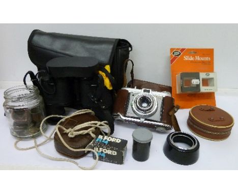 A Kodak Retinette 35mm film camera, equipment including a Weston Master II light meter, bulbs, etc.