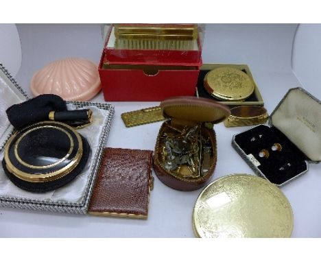 A collection of compacts, tie-clips, cufflinks, etc.