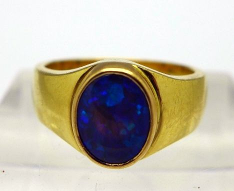 An 18ct gold and opal ring, weight 6.9g, size K