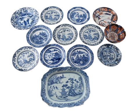 A GROUP OF CHINESE BLUE AND WHITE WARES 18TH CENTURY Comprising: a serving dish with pagodas on islands, 37cm wide, a 'figura