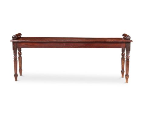 A MAHOGANY HALL BENCH  SECOND QUARTER 19TH CENTURY With cylindrical arms above a solid seat and turned legs 54cm high, 137cm 