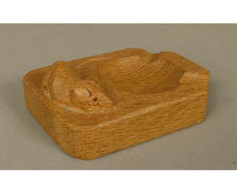 THOMPSON OF KILBURN 'MOUSEMAN' AN OAK ASHTRAY, rectangular with two canted corners, carved in relief with a mouse, 10cm x 7.5