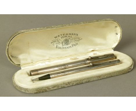 WATERMAN - A STERLING SILVER FOUNTAIN PEN AND PROPELLING PENCIL, each with engine turned bands, initialled J.W, fitted Waterm