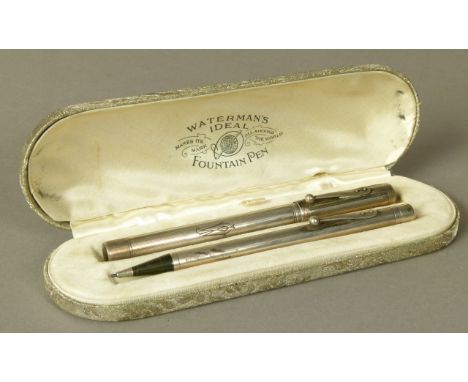 WATERMAN - A STERLING SILVER FOUNTAIN PEN AND PROPELLING PENCIL, each with engine turned bands, initialled J.W, fitted Waterm