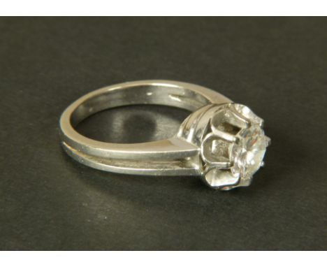 A SINGLE STONE DIAMOND RING in 14ct white gold c.1950, the brilliant cut stone claw set in a French style crown setting and f