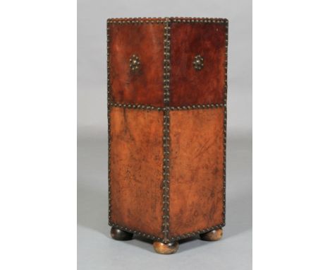 AN EDWARD VII CLOSE NAILED LEATHER COVERED STICK STAND, of square outline, on bun feet, 26cm square x 67cm high 