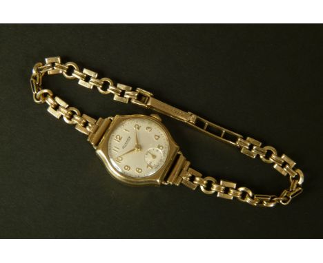 A ROTARY LADY'S MANUAL WRISTWATCH, c.1957, in 9ct gold tonneau case no. 87757 by Dennison signed 57810, 15 jewelled lever mov