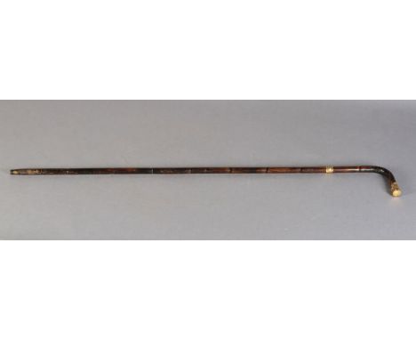 A ROLLED GOLD MOUNTED BAMBOO WALKING STICK, the handle with gold plated cap embossed with ferns and rose blooms, the end init