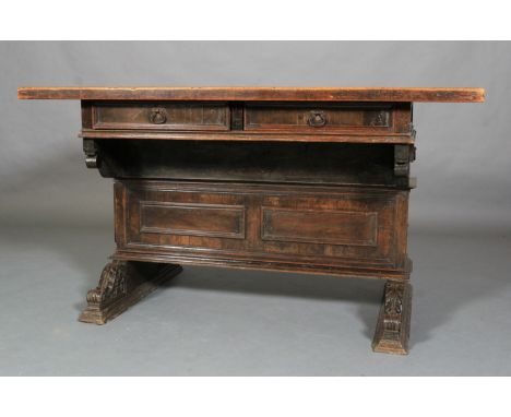 A GERMAN WALNUT AND OAK TABLE, 17th century and later, the moulded frieze having two drawers with ring handles, above a panel