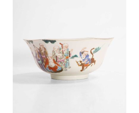 A Chinese famille rose bowl, of hexagonal form, painted with numerous Buddhist immortals in a garden, with a six-character Da
