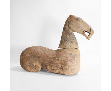 A Chinese grey pottery horse, Han dynasty (206 BCE-CE 220), with traces of red painting against a grey slip ground,approximat