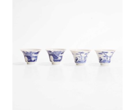 Two pairs of Chinese blue and white wine cups, Guangxu (1875-1908), each of waisted form, painted with a landscape or a liter