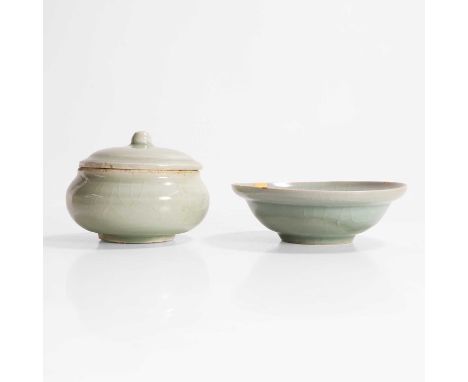 A Chinese celadon-glazed bowl, Southern Song dynasty (1127-1279), the rounded sides rising from a circular foot to a broad fl