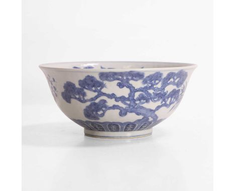 A Chinese blue and white bowl, possibly Kangxi, the rounded sides rising from a circular foot to a flared rim, the interior p