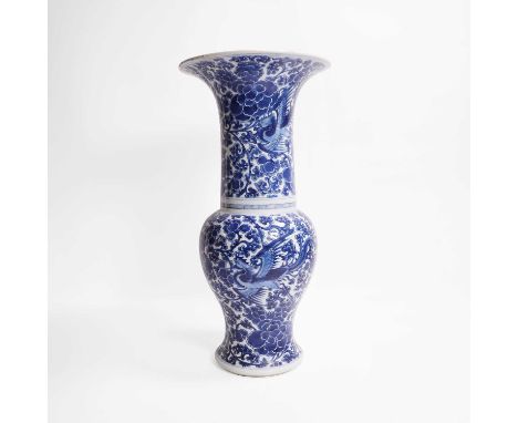 A Chinese blue and white vase, Kangxi (1662-1722), of baluster form, surmounted by a long cylindrical neck everting to a trum