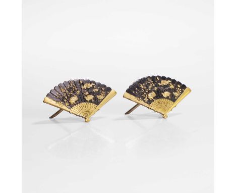 A pair of Japanese shakudo mixed-metal table cardholders, early 20th century, each in the shape of a fan, decorated with quai