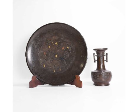 A Japanese bronze plate, 19th/20th century, of circular form, engraved with egrets in a lotus pond, inlaid with gold, silver 