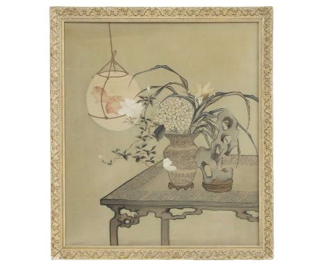 A Chinese embroidered panel, 19th-20th century, possibly kesi, decorated with a table with a vase of flowers and a rock on to