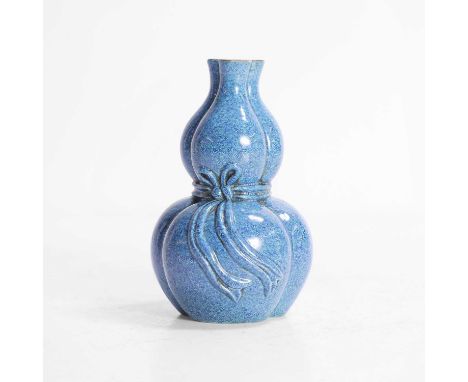 A Chinese robin's-egg-glazed double gourd vase, formed in three lobes set over a low conforming foot, wreathed by a sash fast