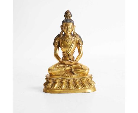 A Chinese gilt-bronze Buddha, Qing dynasty (1644-1911), seated cross-legged on a double-lotus pedestal, wearing elaborate bea