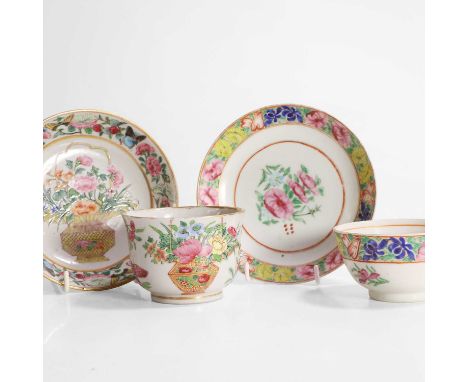 Two pairs of Chinese Canton famille rose cups and saucers, 19th century, one pair painted with a basket of flowers and butter