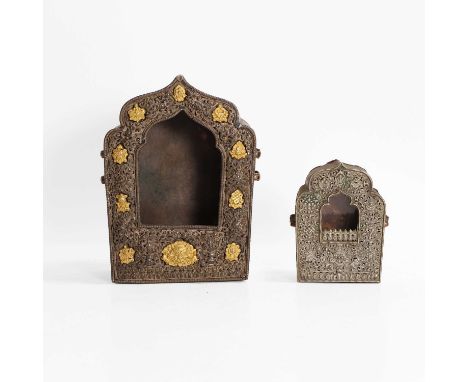 Two Tibetan gilt, white-metal and copper travel shrines, 19th century, each of pentagonal ogival form, one with gilt-metal Bu