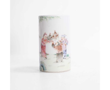 A Chinese famille rose brush pot, 20th century, of cylindrical form, painted with figures admiring birds in a garden, with a 