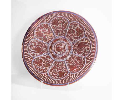 Attributed to Ulisse Cantagalli, 19th century, a ruby-copper lustreware charger, decorated in red, white and blue, centred wt