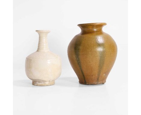 A Chinese white-glazed vase, Liao dynasty (907-1125), the cylindrical body rising from a circular foot to a ribbed neck and a