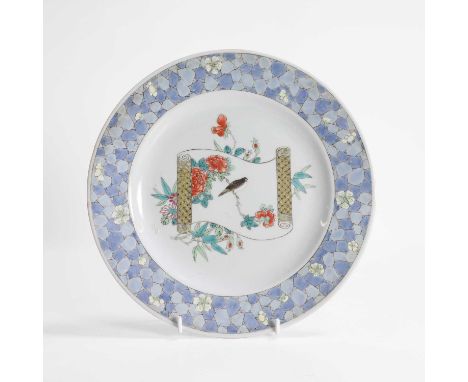 A Chinese famille rose dish, Qing dynasty (1644-1911), of circular form, painted with an open scroll amongst flowers, with a 