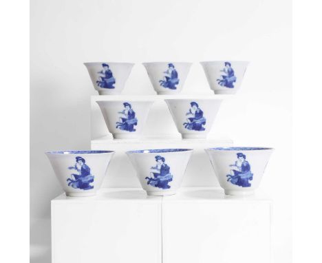 A collection of Chinese blue and white teacups, Kangxi (1662-1722), each tapering body rising from a circular foot to a flare
