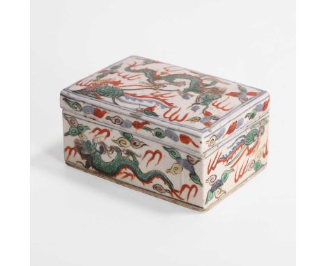 A Chinese wucai box and cover, Kangxi (1662-1722), of rectangular form, painted with phoenixes and dragons, with a six-charac