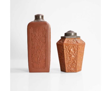 Two Chinese Yixing stoneware tea caddies, 18th/19th century, one square form, moulded with dragons or flowers in shaped panel