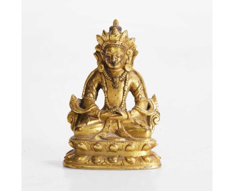 A Tibetan gilt-bronze miniature bodhisattva, late Qing dynasty, seated cross-legged on a double-lotus pedestal, his hands in 