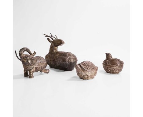 A collection of Cambodian white-metal betel nut boxes and covers, early 20th century, comprising forms of a reclining stag, a