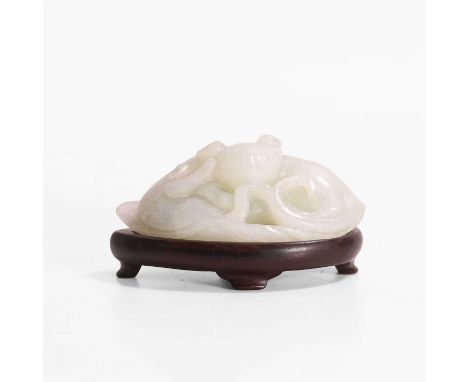 A Chinese jade carving, of two cats resting on a large leaf, 7.5cm long, wood stand (2)Condition ReportJade with minute chips