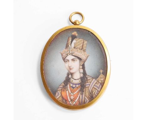 An Indian painted miniature on ivory,  early 19th century, depicting Arjumand Banu Begum or Mumtaz Mahal, in a glazed gilt-me