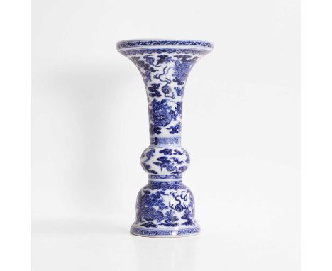 A Chinese blue and white gu vase,  Qianlong (1736-1795), finely modelled with a trumpet neck above a central bulb and a bell-