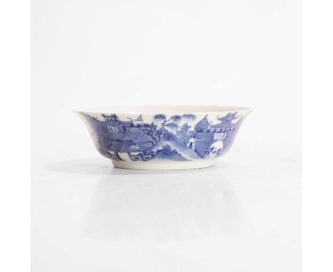 A Chinese blue and white saucer, Guangxu (1875-1908), the rounded sides rising from a circular foot to a flared rim, painted 