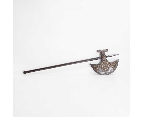 An Indian brass-inlaid ceremonial axe, 19th century, North Indian, the crescent-shaped blade inlaid with rosettes in relief, 