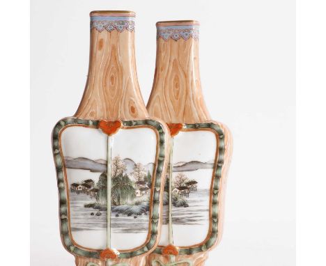 A pair of Chinese faux bois-enamelled porcelain vases, Republic period (1912-1949), each fan-shaped body painted with landsca