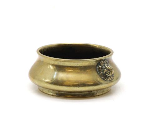 A Chinese bronze incense burner, 19th century, the compressed globular body flanked by two mask handles, with a six-character