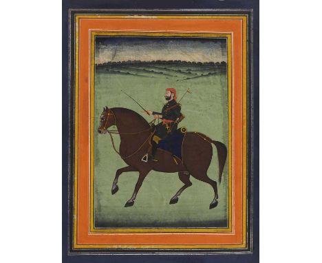 An Indian equestrian portrait, 19th century, Rajasthan, of a British Indian army officer on horseback, dressed in formal unif