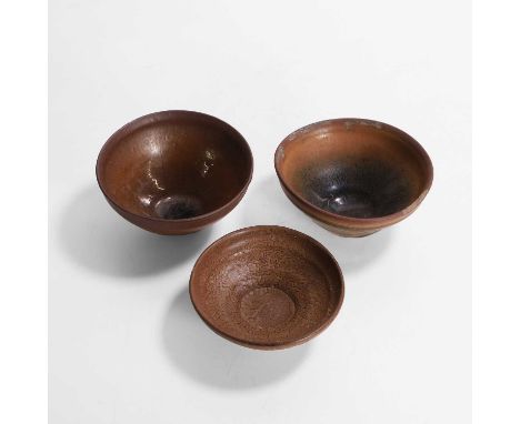 Three Chinese Jian ware tea bowls, Southern Song (1127-1279), each with deep rounded sides, rising from a short straight foot