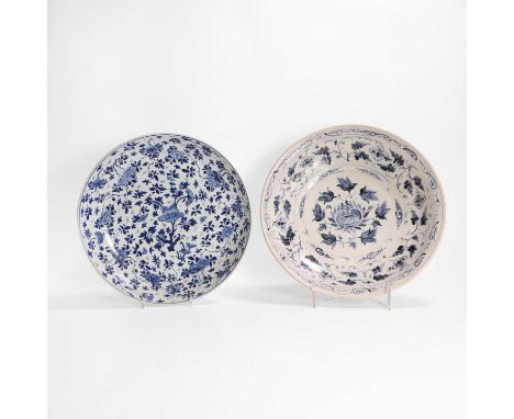 A Chinese blue and white charger, Kangxi (1662-1722), of circular form, painted with sprigs of peony and prunus, 35.8cm diame