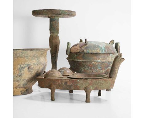 A collection of Chinese bronzes,  possibly Han dynasty, comprising a bronze ritual tripod food vessel and cover, ding, a bron