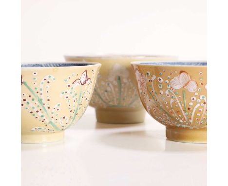 A Chinese 'Batavian' glazed tea bowl, Kangxi, c.1700-10, the interior painted with flowers and leaves in famille verte, the e